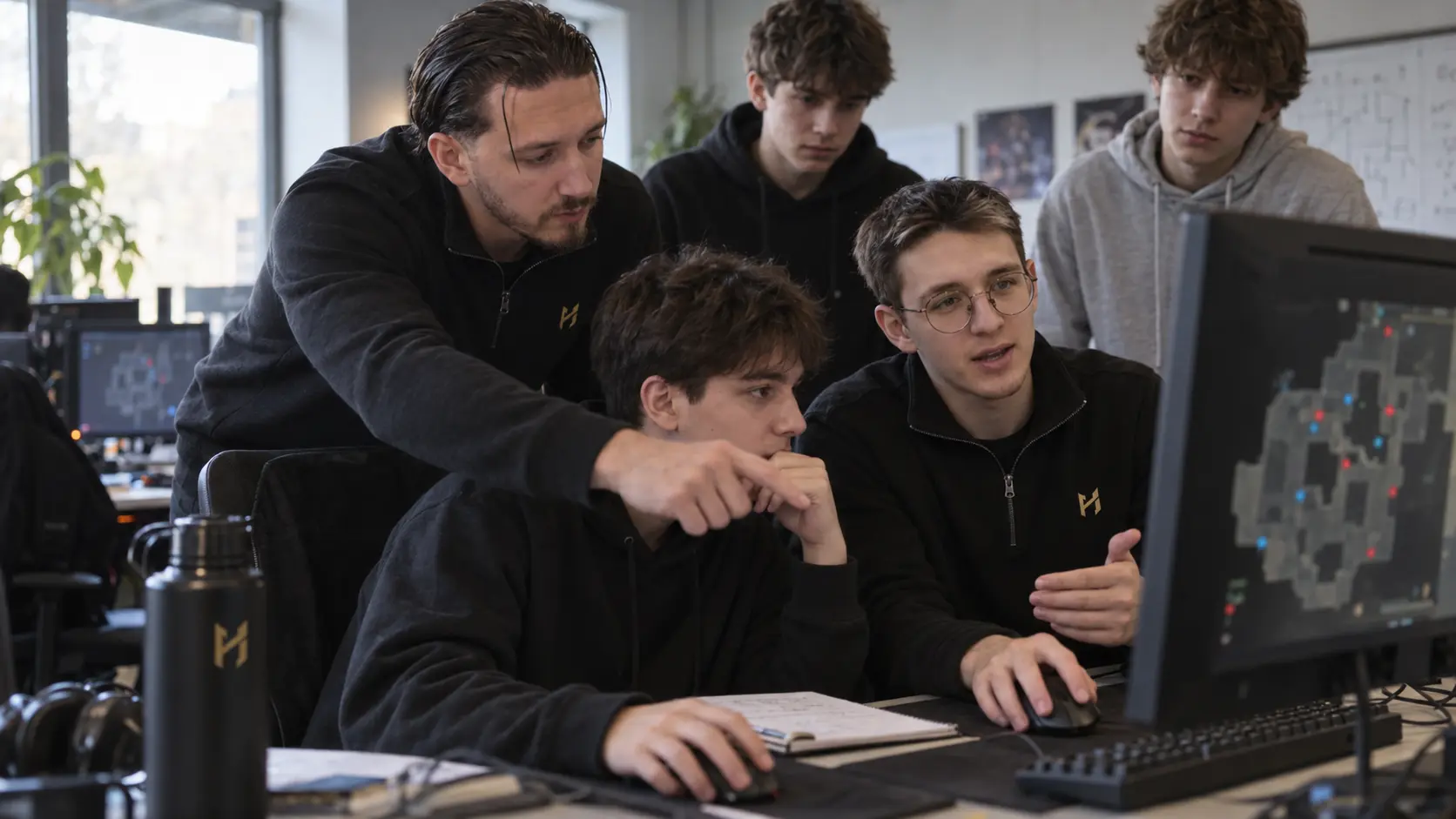 Vadox and Alex reviewing a Counter-Strike session with players